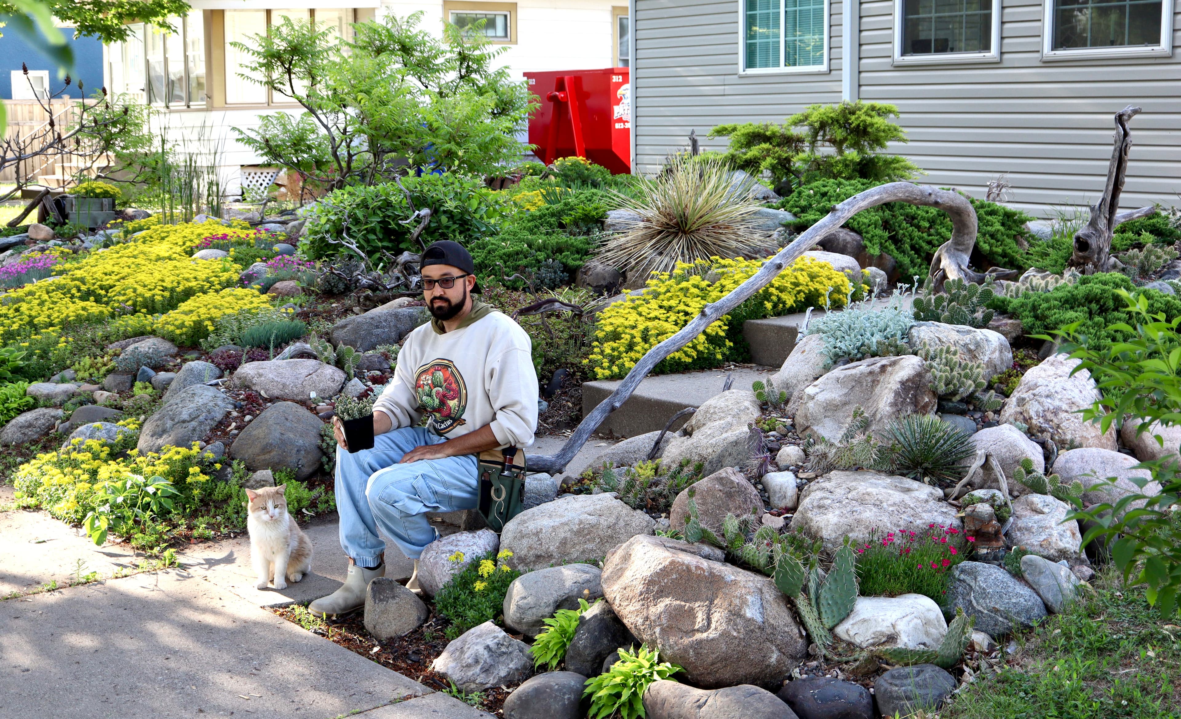 Johnny Rodriguez working among rockery plants.